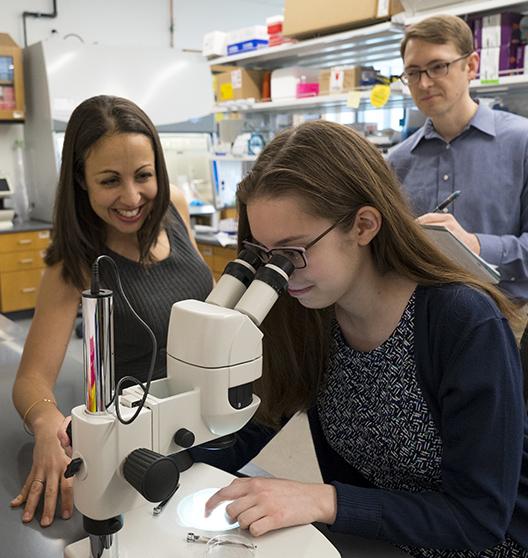 Image of Students performing experiment