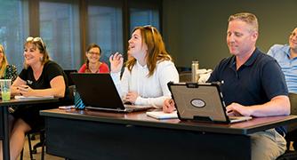 An image of adult students in a classroom.